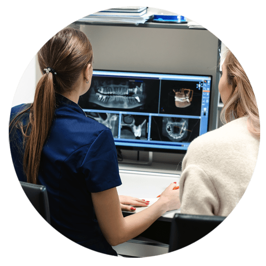 dental assistant discussing implant procedure